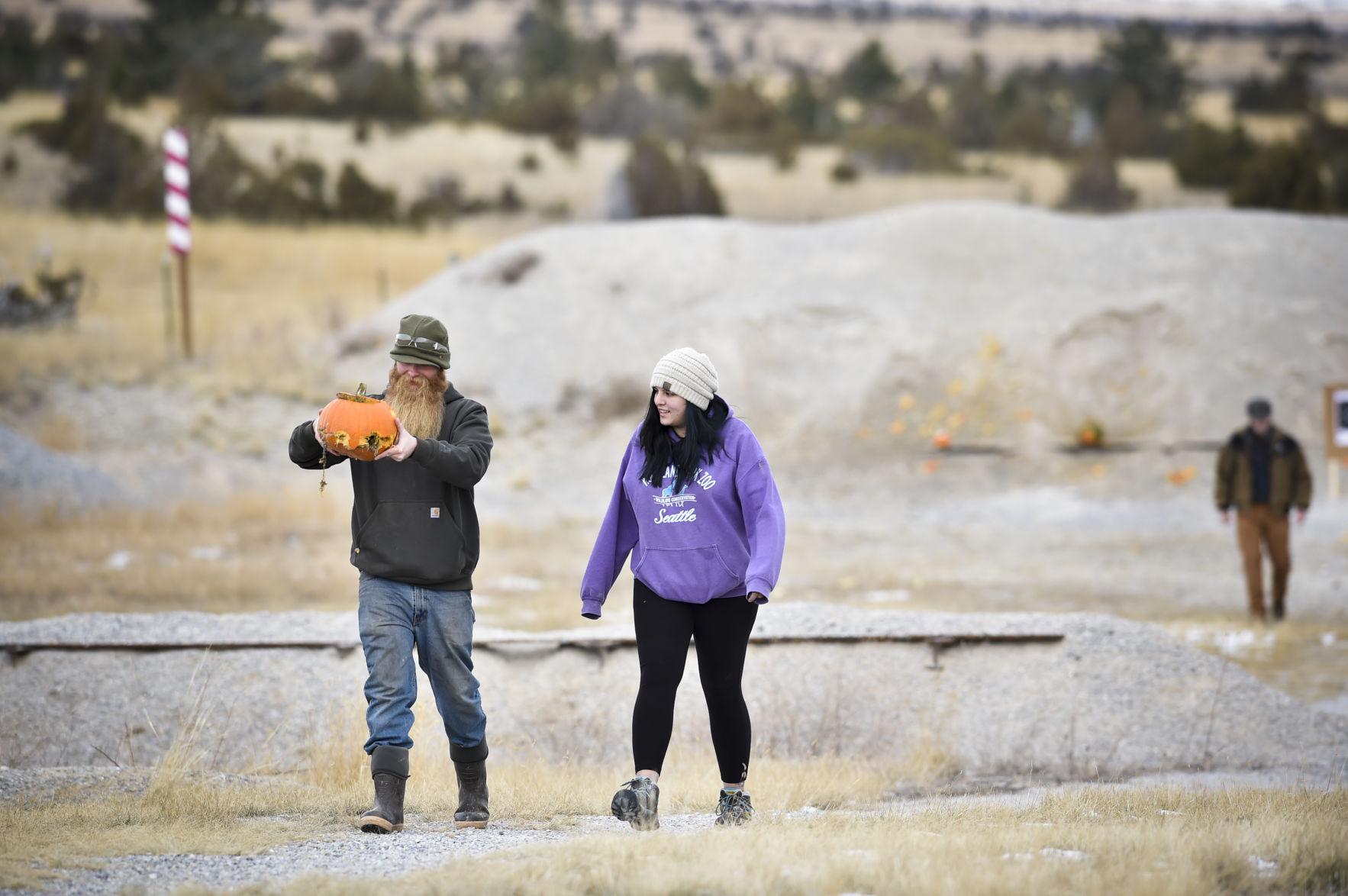 Participants retrieve a bullet ridden pumpkin Saturday that didn't explode the way it was supposed to.